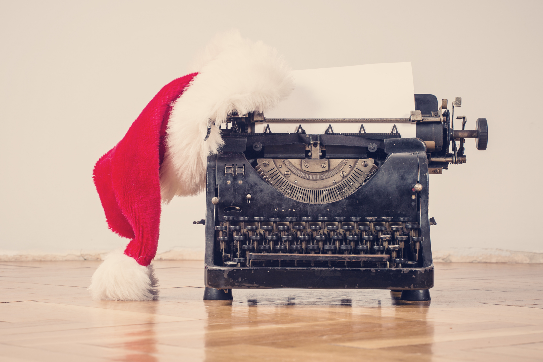 Vintage typewriter with a Santa hat